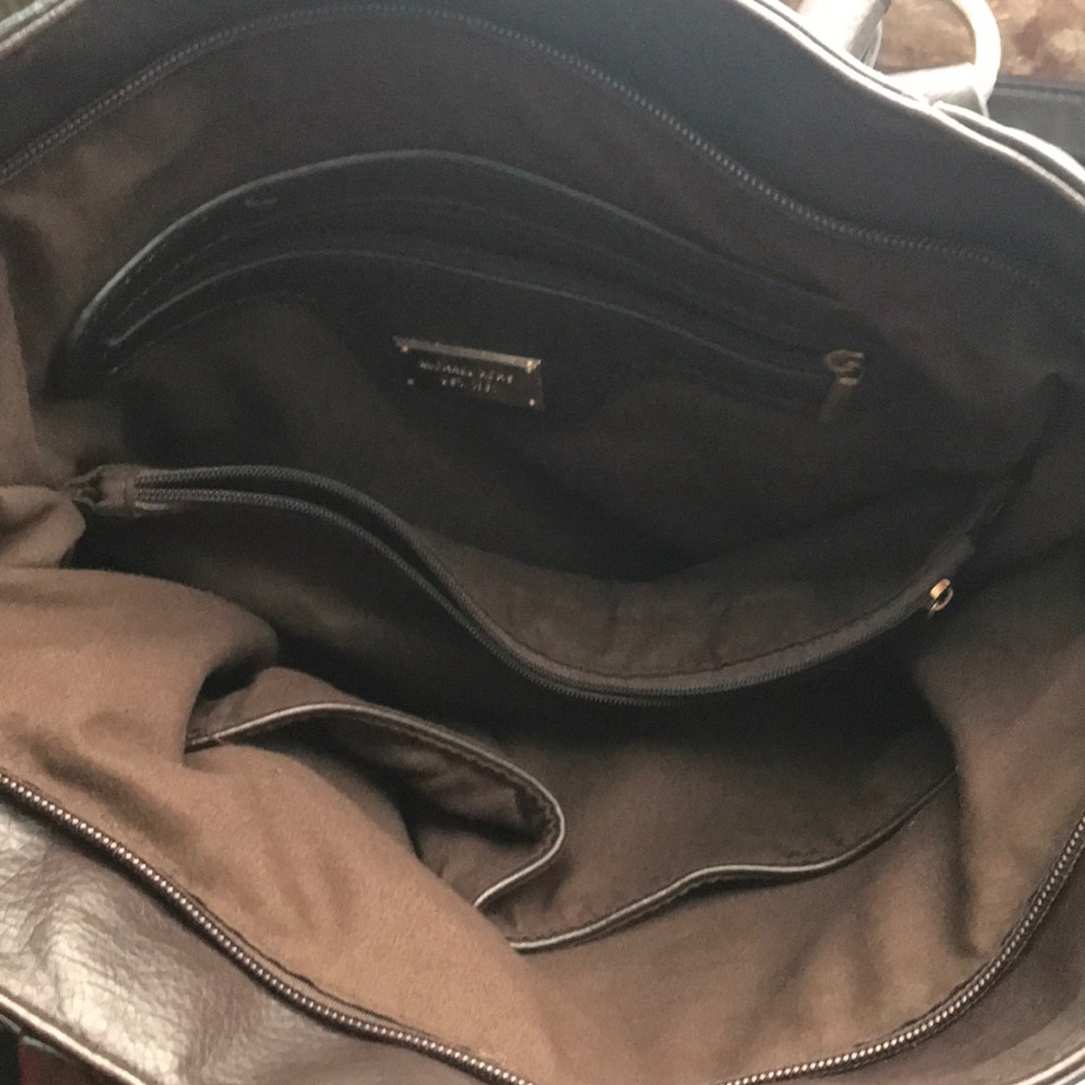 A brown Michael Kors purse